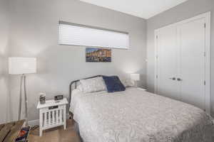 Carpeted bedroom featuring a closet