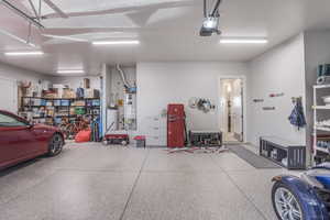 Garage with a garage door opener and water heater