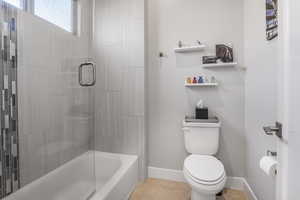 Bathroom featuring toilet and tile patterned floors