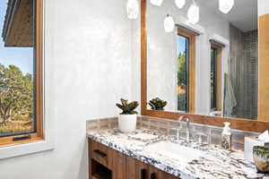 Bathroom with plenty of natural light and vanity