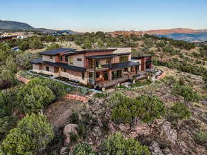 Back of house featuring a deck with mountain view