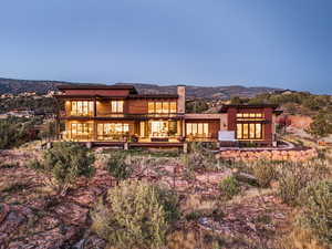 Rear view of property with a mountain view