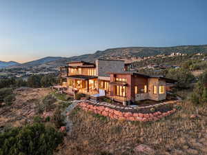 Back house at dusk with a mountain view