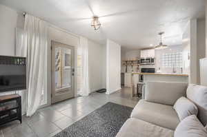 Living room featuring light tile patterned floors