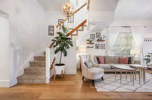 Living room featuring a chandelier and hardwood / wood-style floors