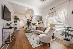 Living room featuring radiator and hardwood / wood-style floors