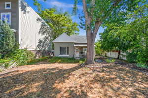 Back of house featuring a porch