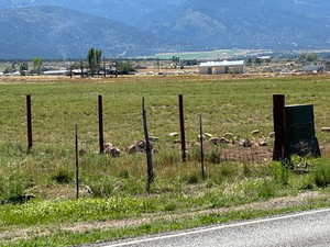 Property view of mountains with a rural view