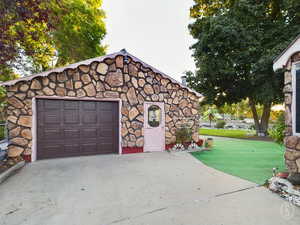 Garage featuring a yard