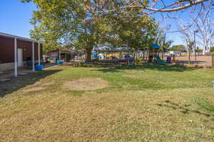 View of yard featuring a playground