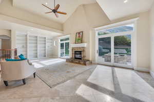 Great room that looks onto backyard with custom built in bookshelves