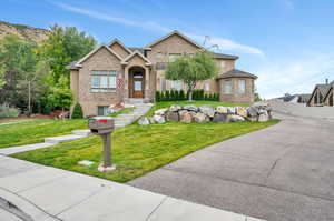 View of front of property with a front yard