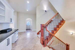 2nd stair case in hallway by garages