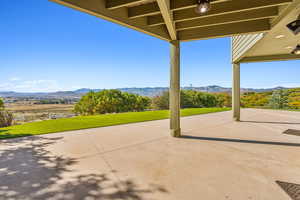 View of patio with a mountain view