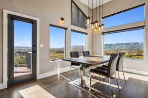 Sunroom / solarium with a wealth of natural light and a mountain view