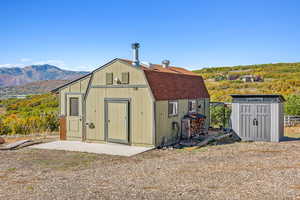 View of outbuilding with a mountain view