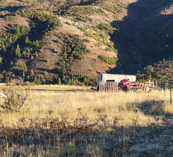 Property view of mountains featuring a rural view