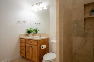 Bathroom with vanity and toilet