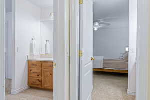 Interior space featuring ceiling fan and vanity