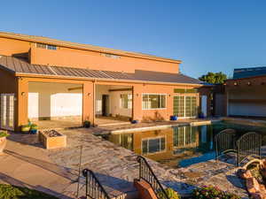 Rear view of property with a patio