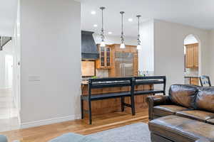 Living room with light hardwood / wood-style flooring