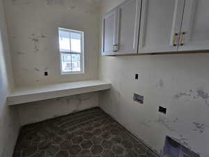 Laundry area featuring hookup for a washing machine, cabinets, and electric dryer hookup