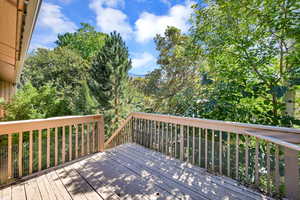 Private and secluded deck surrounded by trees and views.