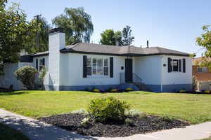 Ranch-style home with a front lawn