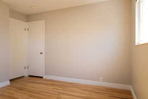 Empty room featuring light hardwood / wood-style flooring