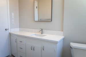 Bathroom with vanity and toilet