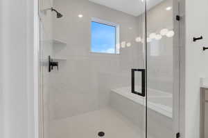 Bathroom featuring vanity and walk in shower