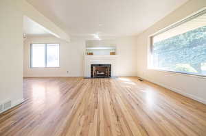 Refinished hardwood floors with fireplace