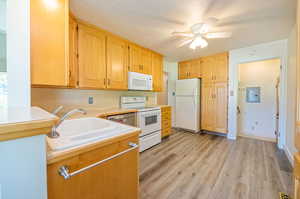 Kitchen with durable LPV flooring. Fridge stays