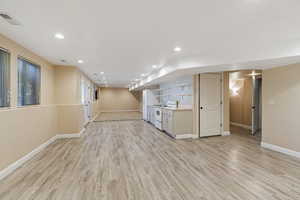 Basement featuring light hardwood / wood-style floors