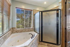 Bathroom with shower with separate bathtub