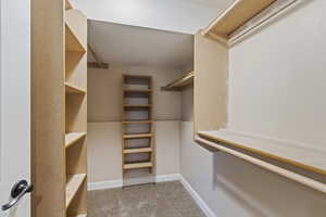 Walk in closet featuring carpet