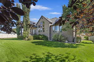 View of front of home featuring a front lawn