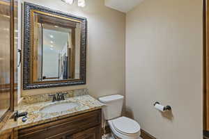 Bathroom featuring vanity and toilet