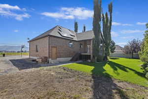 View of property exterior with a yard