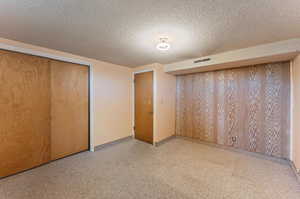 Basement with a textured ceiling