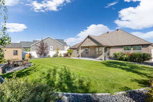 Exterior space with a lawn and a patio area