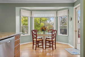 Dinette space featuring hardwood floors, plenty of natural light