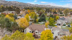 Drone / aerial view of back of home, featuring a mountain view