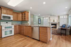 Updated kitchen with double oven, custom cabinets and beautiful hardwood floors walks into Family Room