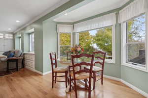 Dinette space featuring hardwood  floors, plenty of natural light