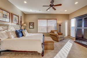 Bedroom featuring ceiling fan and light carpet