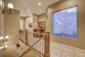 Hall with light tile patterned floors