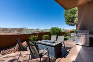 View of patio featuring a grill