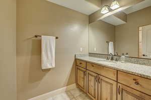 Bathroom featuring vanity and tile patterned flooring