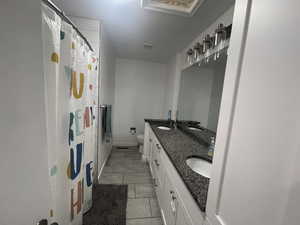 Bathroom with walk in shower, vanity, and toilet